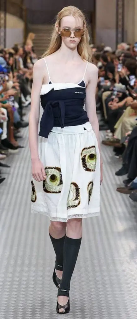 Avocado print skirt styled with corset top from Miu Miu Spring 2025
