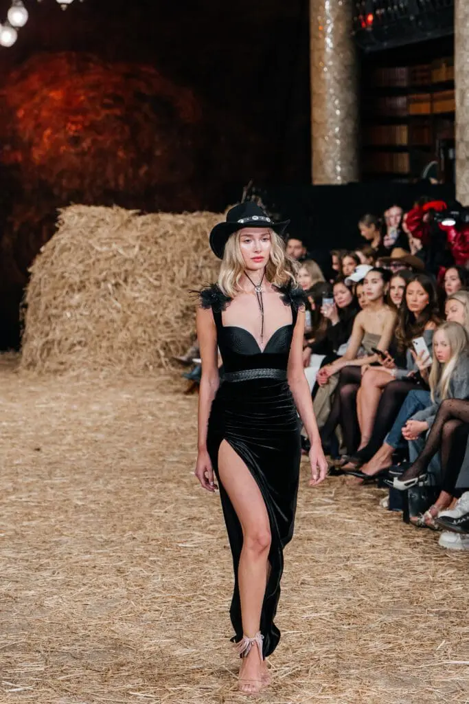 Black velvet thigh-slit gown with cowboy hat