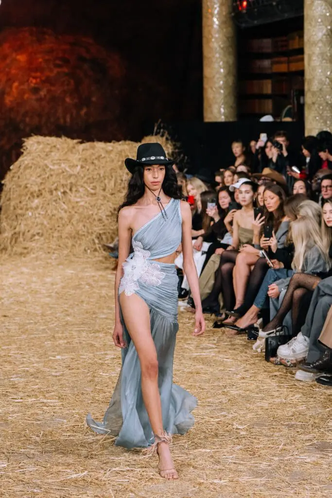 Blue one-shoulder slit gown with cowboy hat
