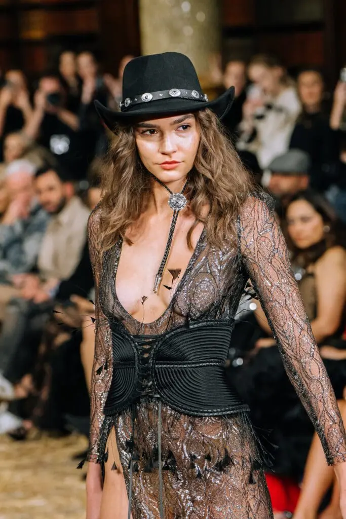 Sheer black lace dress with wide corset, hat