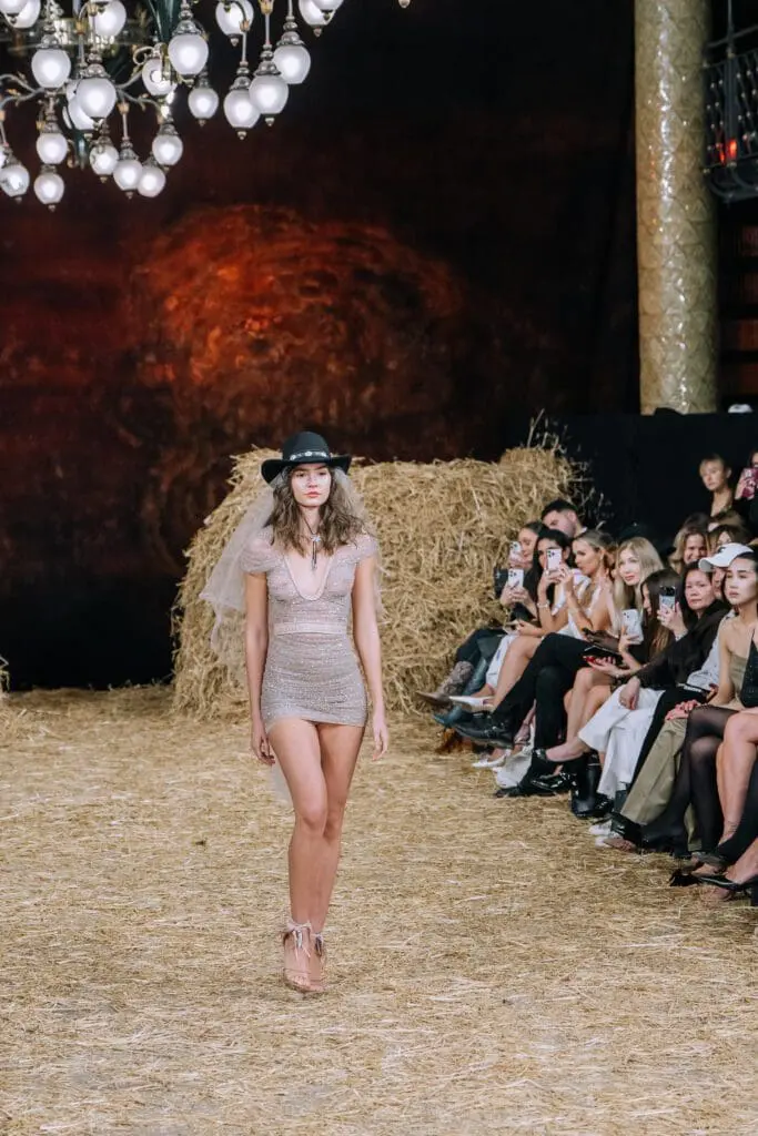 Sparkling mini dress with cowboy hat and veil