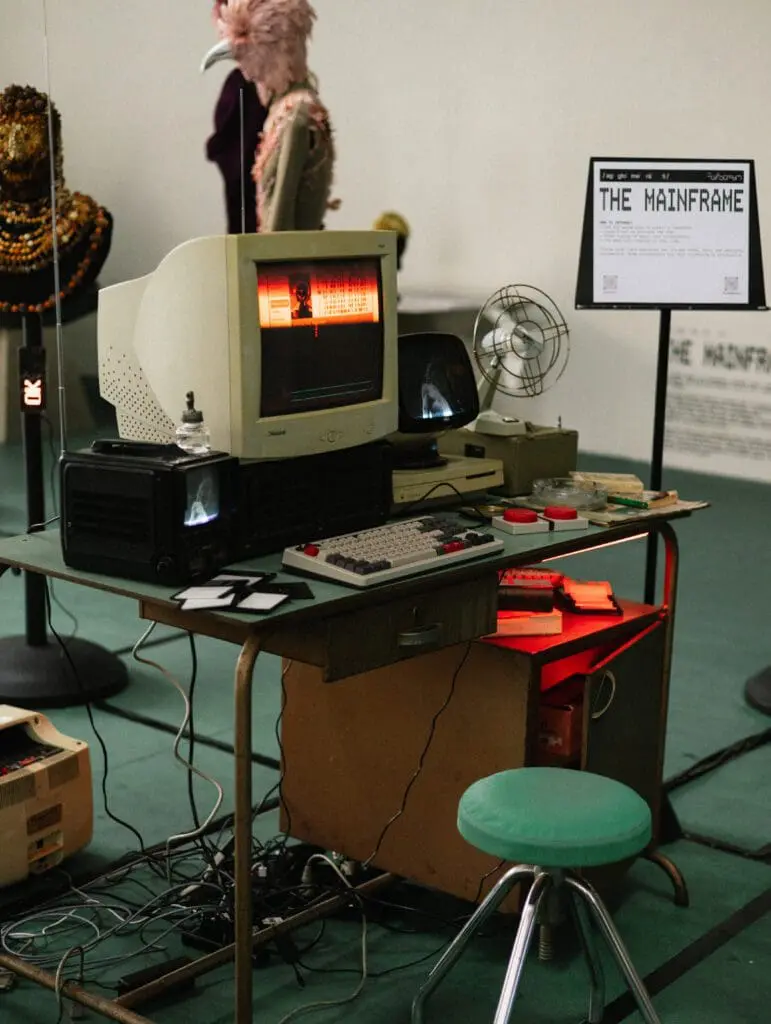 Retro computer setup with Mainframe installation signage