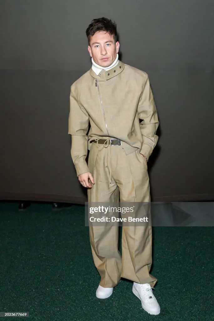 Barry Keoghan in beige suit at a fashion event, symbolizing Gen Z masculinity
