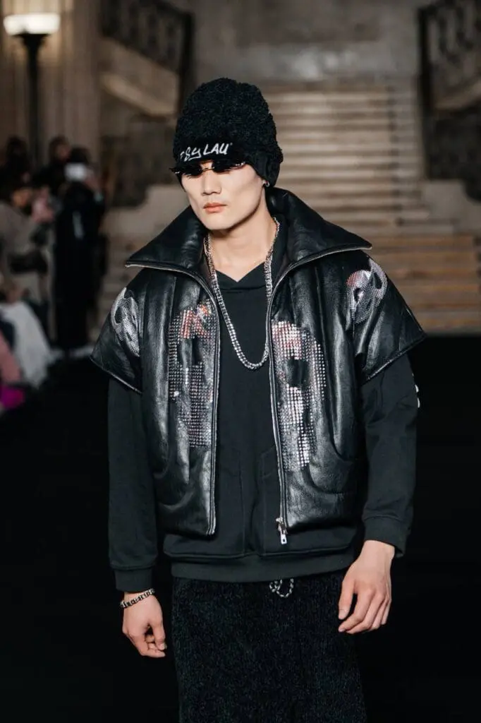 Black padded vest with crystal skull motifs