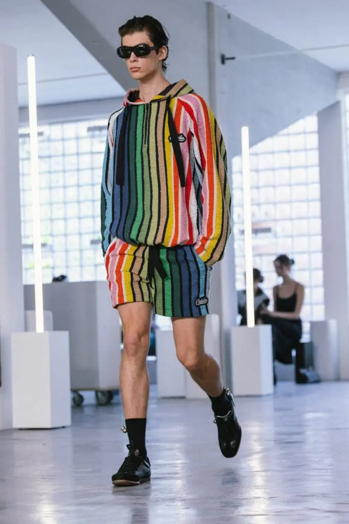 Model in striped hoodie inspired by manta alentejana