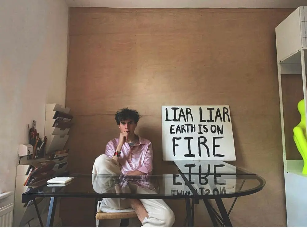 Elijah McKenzie-Jackson with art installation Liar Liar