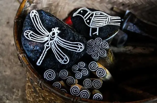 Wooden stamps with bird and swirl patterns used in Hmong batik making
