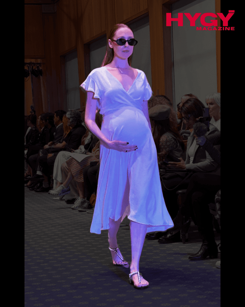 Pregnant model in white tiered maternity dress with sunglasses