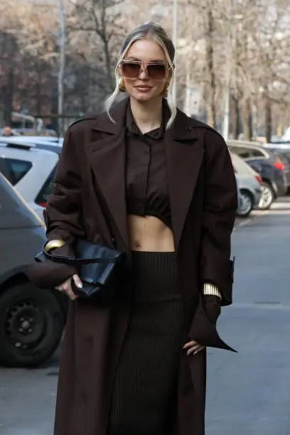 Leonie Hanne in brown coat and glasses at Milan Fashion Week FW 2025