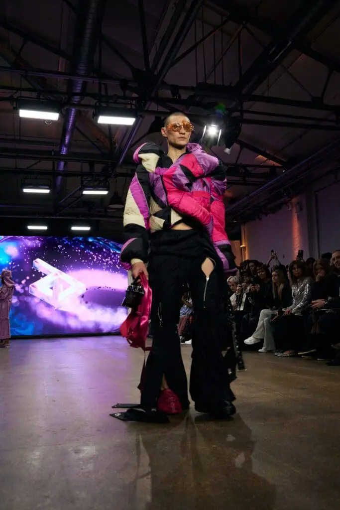Male model in patchwork puffer jacket on London runway