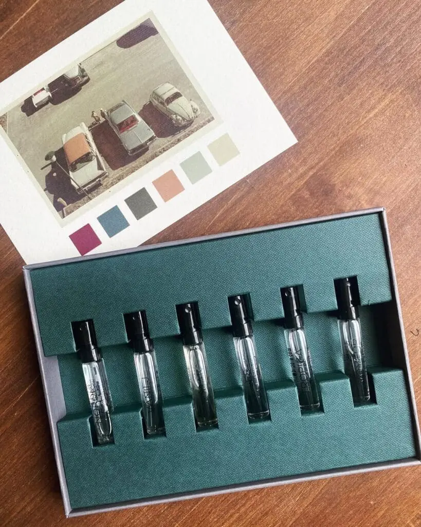 Discovery set of Maya Njie perfumes next to old parking lot photo