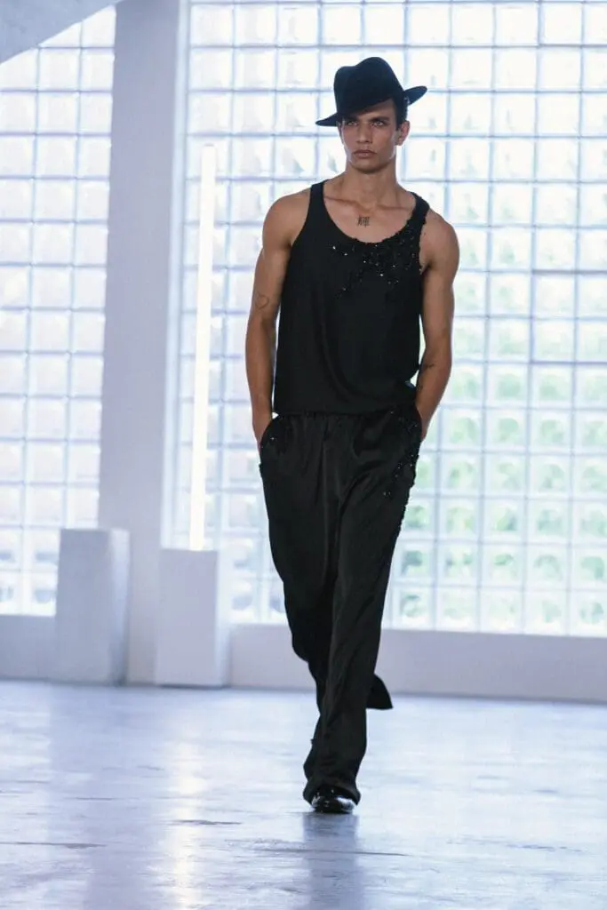 Model in silvery textured outfit at Miguel Vieira SS26