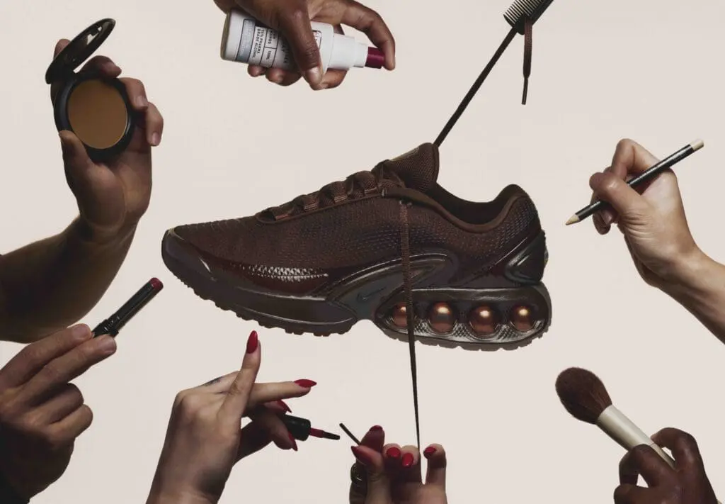 Hands applying makeup around the Nike x Isamaya Ffrench Air Max DN sneaker