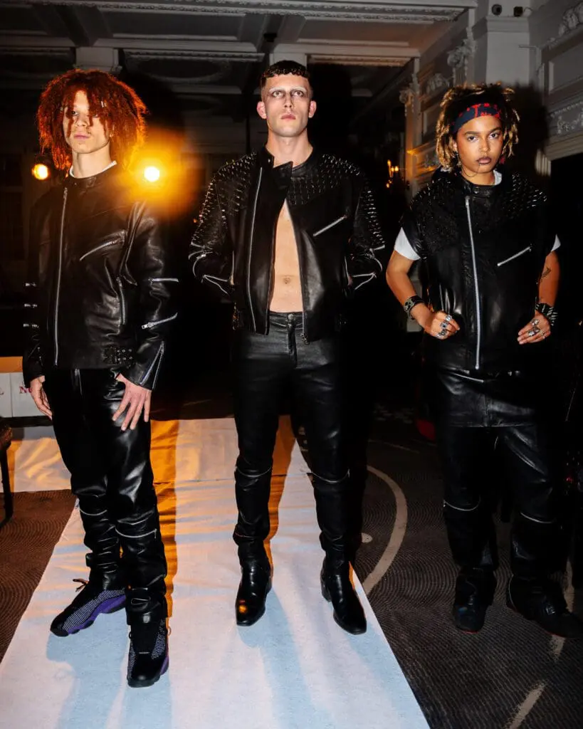 Models wearing black studded leather jackets and streetwear looks