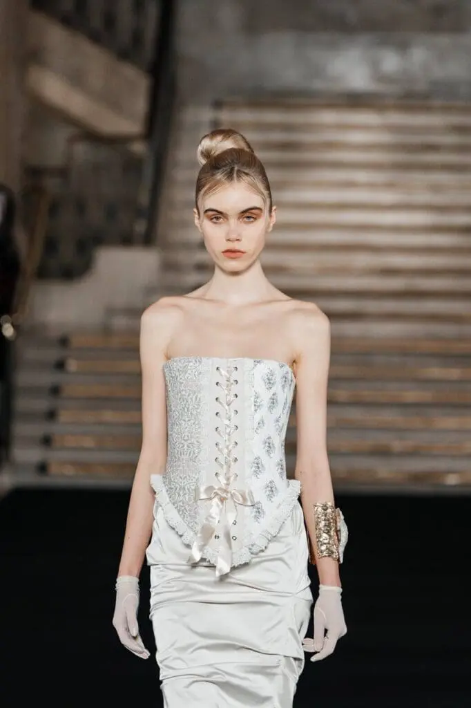 Strapless white corset gown with satin ruching