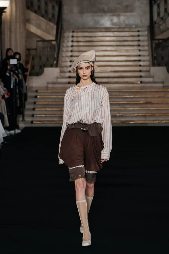 Striped blouse with brown lace shorts and hat