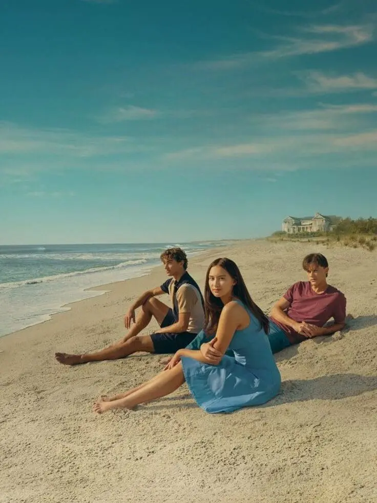 The Summer I Turned Pretty cast sitting on the beach
