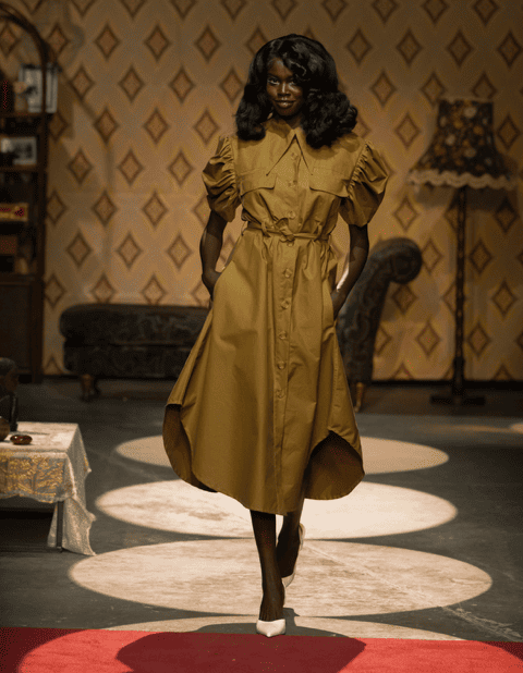 Model with luminous warm makeup and satin skin backstage at Tolu Coker show