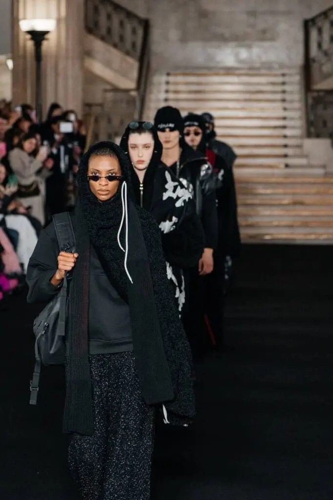 Model in layered dress with parachute-like textures