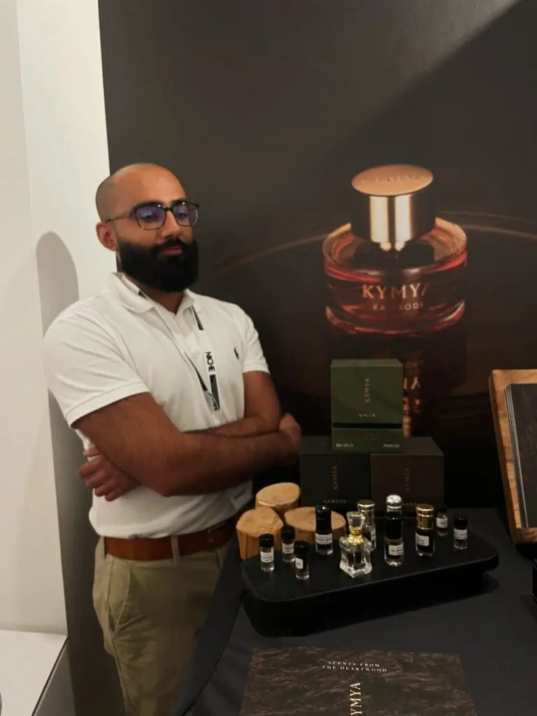AFOWER founder presenting perfumes at stand