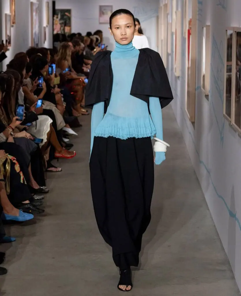 Ashlyn runway model in turquoise layered look NYFW