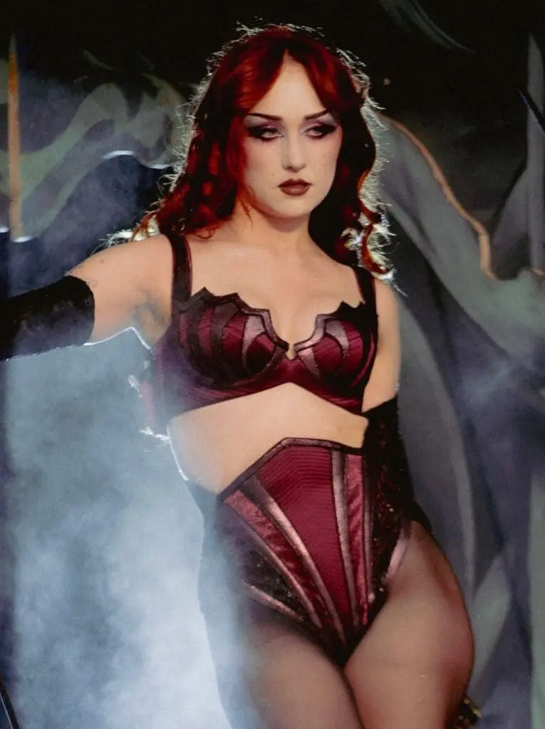 chappell roan performing in red corset stage outfit