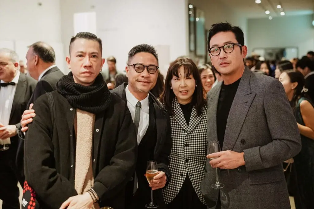 filmmakers and guests posing with glasses at LEAFF