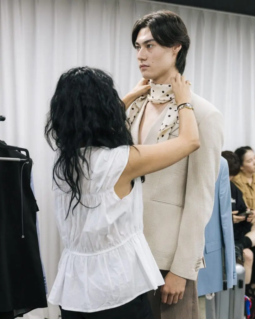 Francesca Cottone styling model in beige suit during CTRL fitting