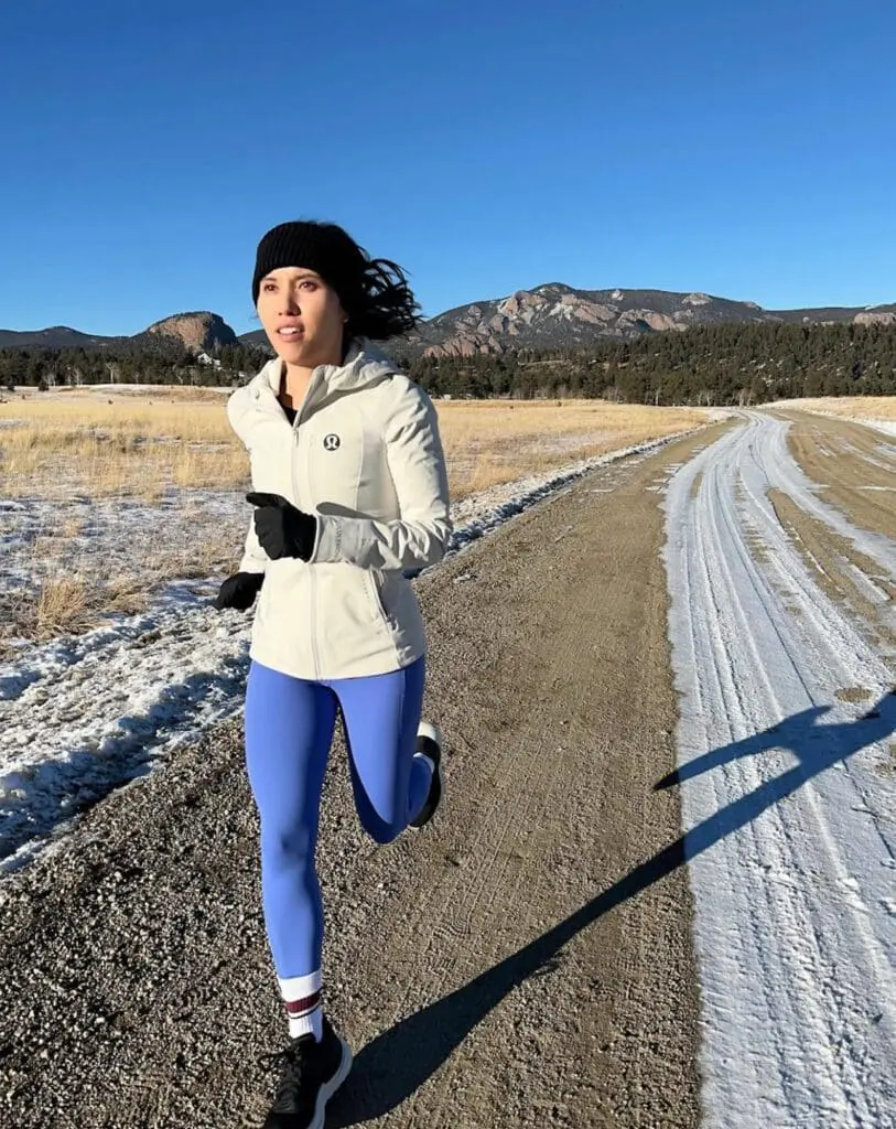 Woman running in Lululemon blue leggings