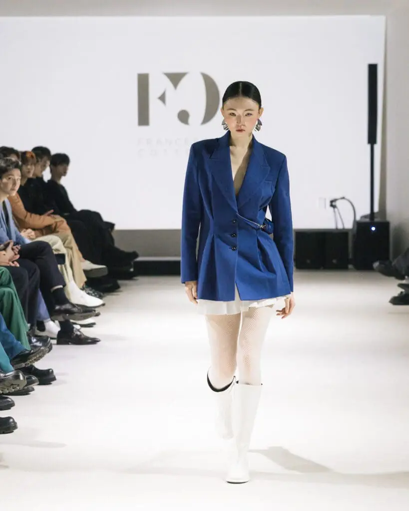 Model Bomin wearing blue blazer and white boots Francesca Cottone