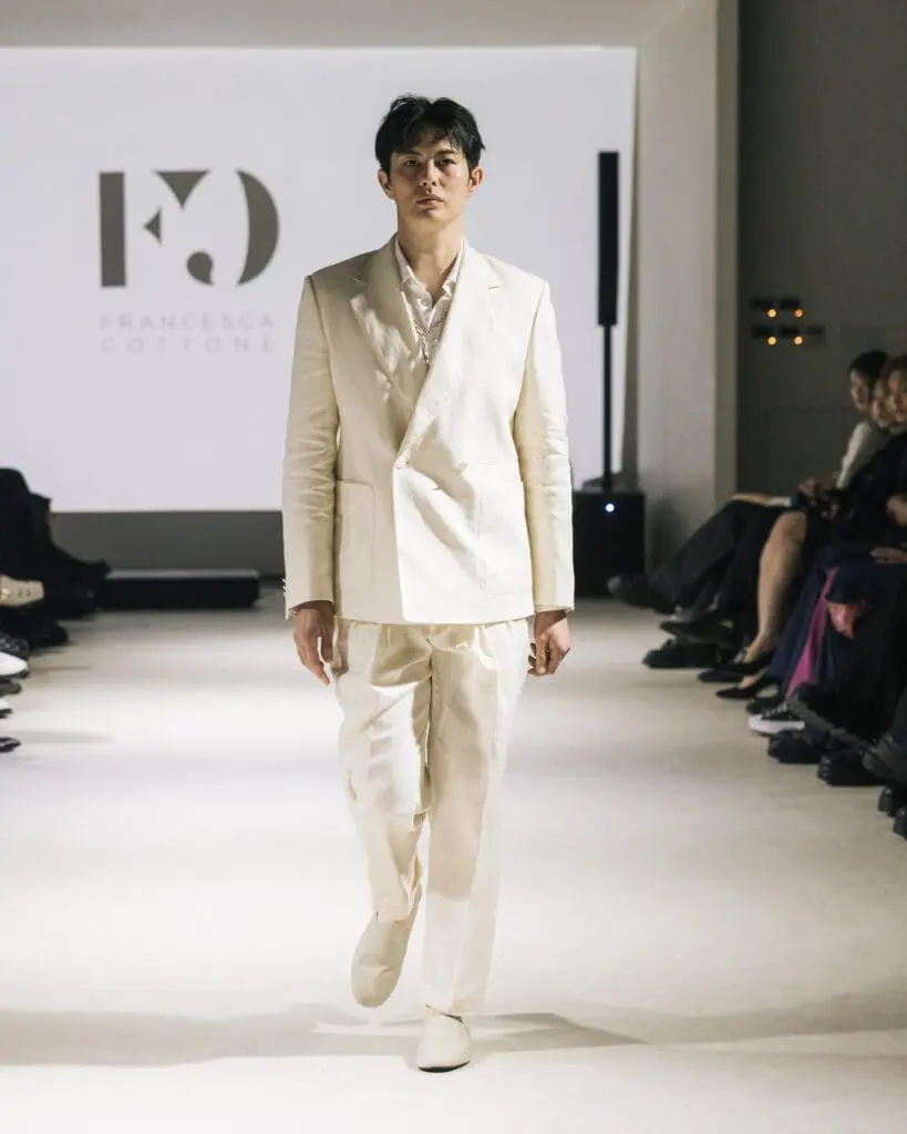 Model Joel Jay Lane in white jacket and black shorts Francesca Cottone