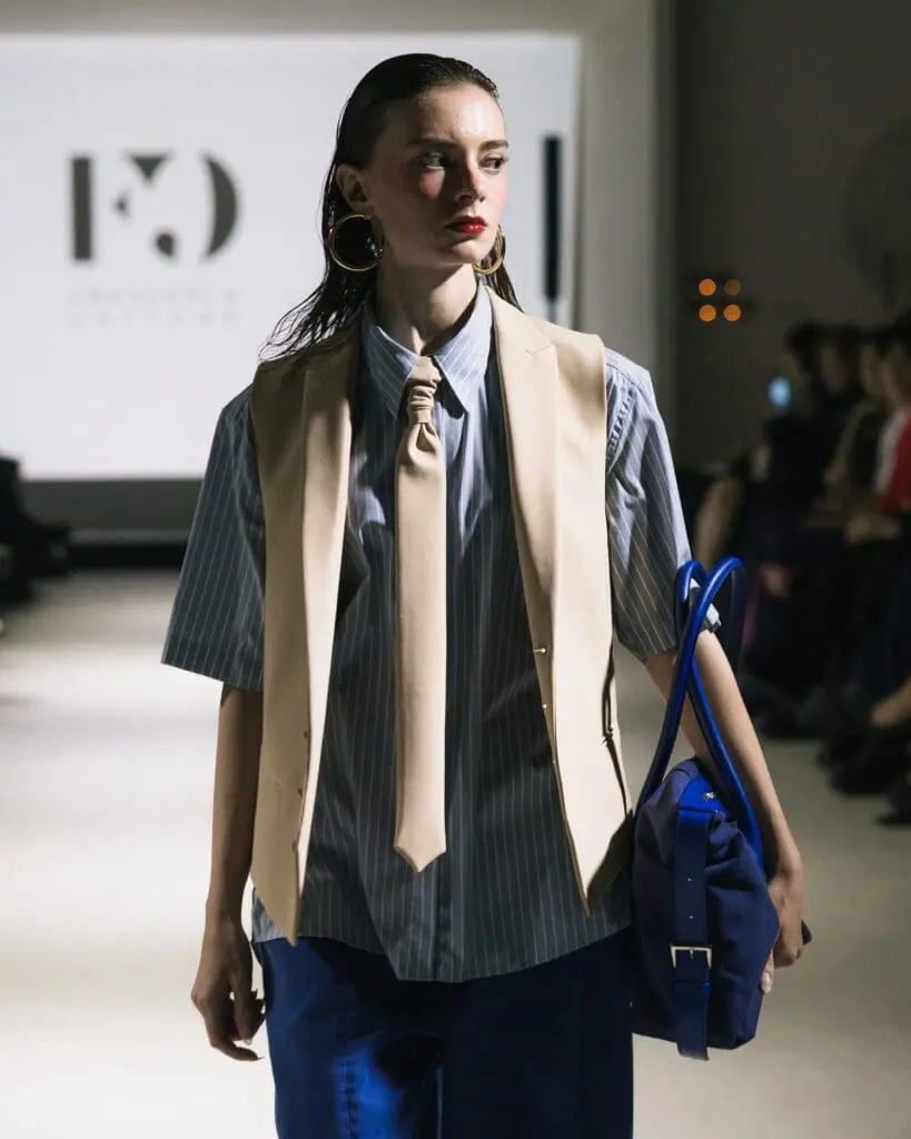 Close-up of model Sasha wearing Francesca Cottone CTRL shirt and vest