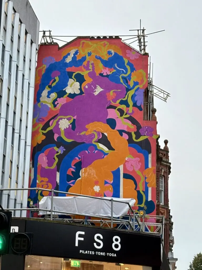 Artist and painting process of Threads in Common mural