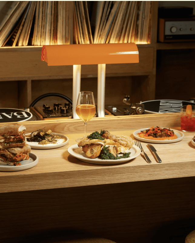 Vinyl bar with food and records in background