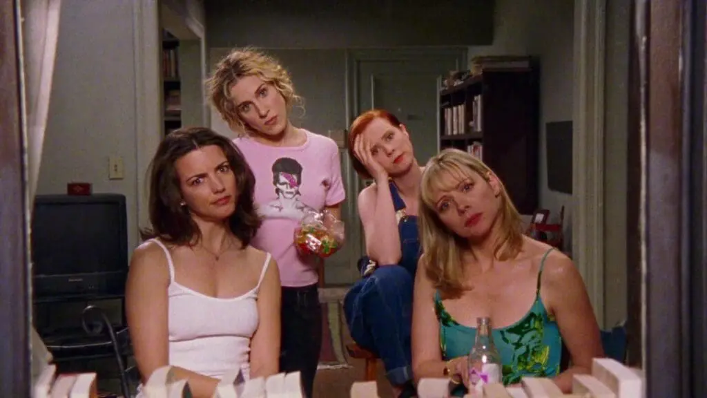 four women sitting together looking thoughtful