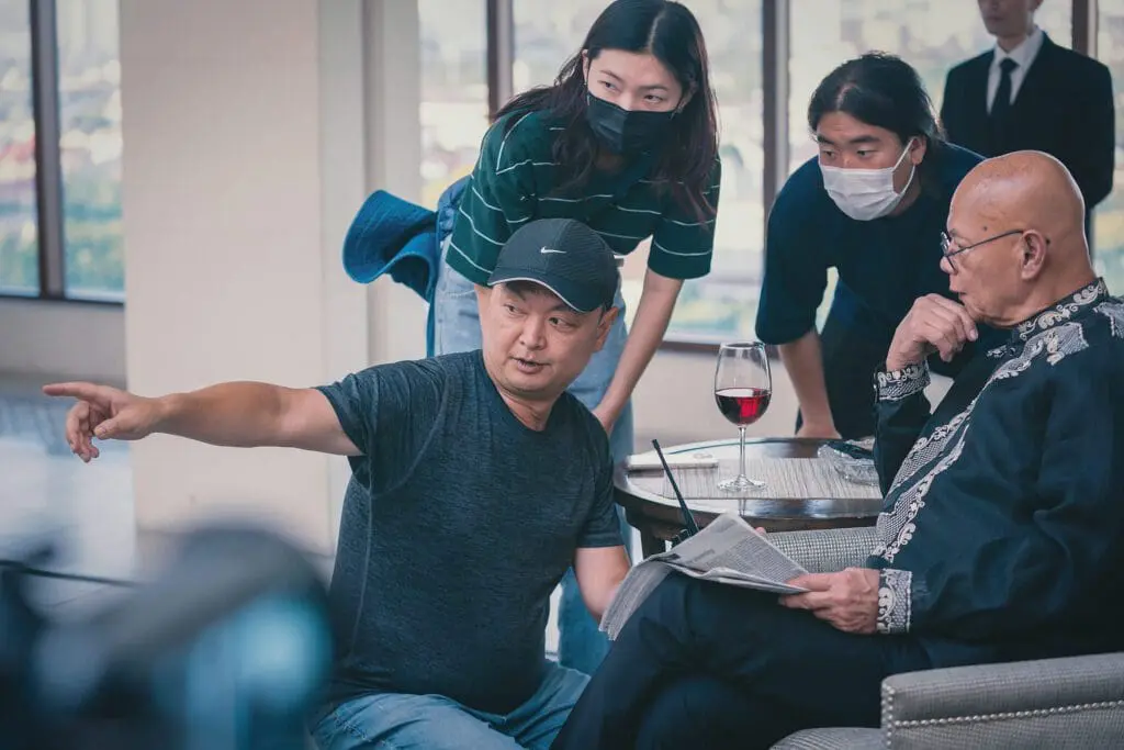 Yoon-sung Kang giving direction to actors during filming