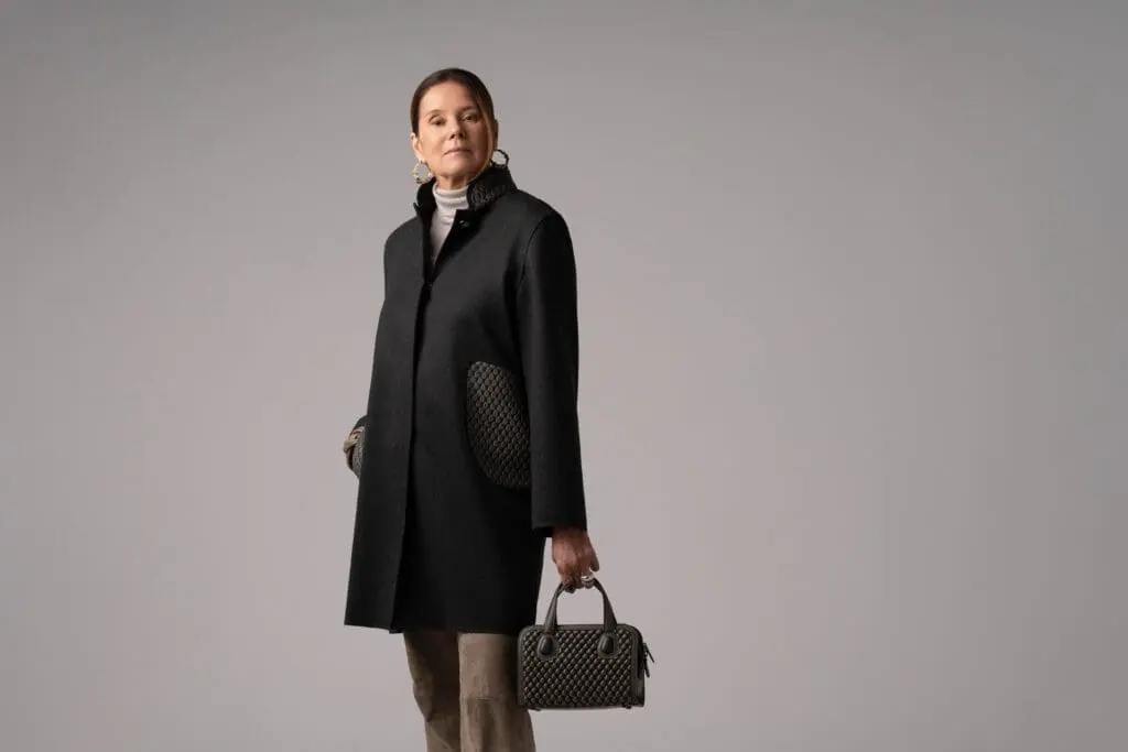 full-length portrait holding bubble leather mini bag