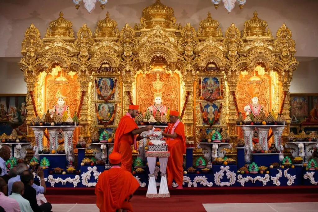 golden shrine with deities and offerings inside Neasden Temple