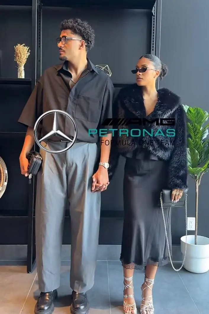 Paddock fashion couple in black satin and relaxed tailoring