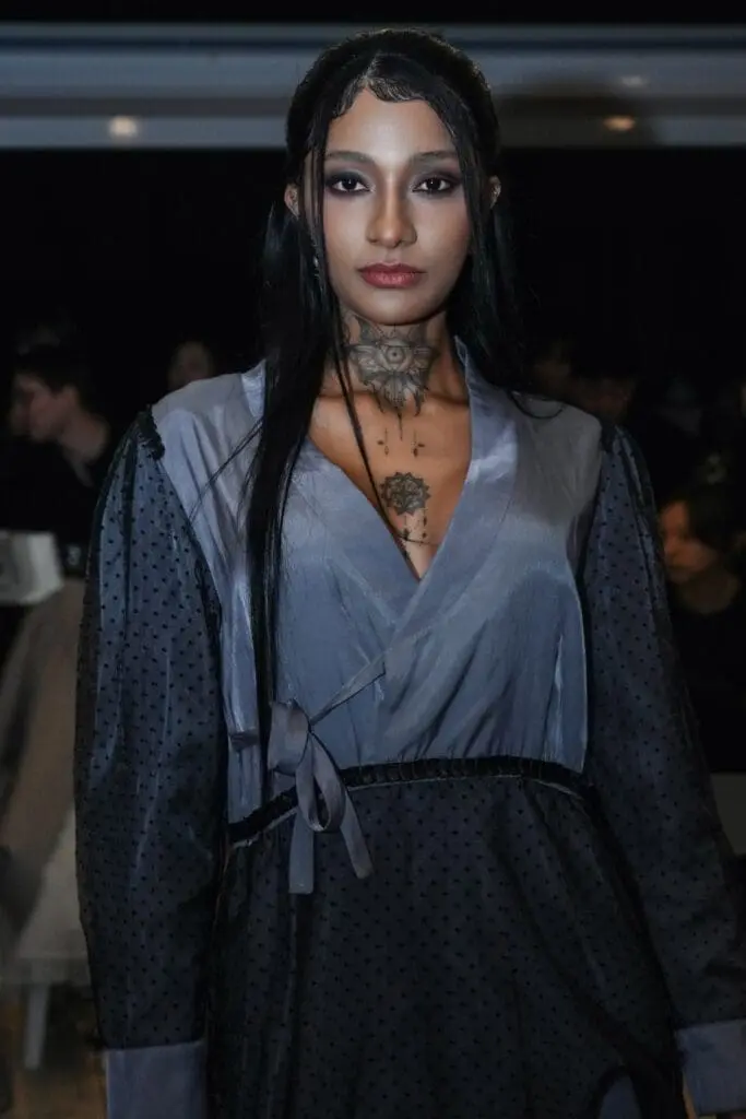 Close-up of blue-grey dress textures on runway