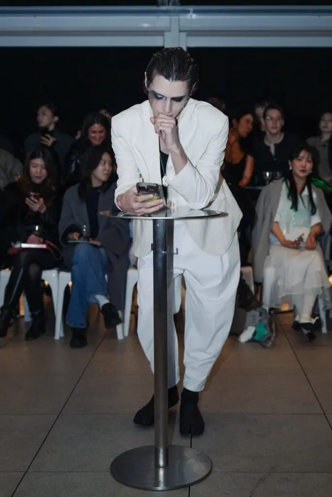 Minimalist white menswear look on the runway