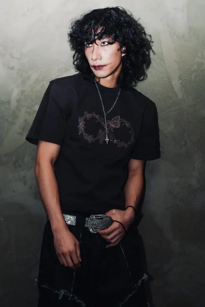 Studio portrait in graphic tee with crystal belt