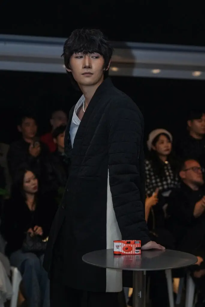 Tailored navy suit portrait on the runway