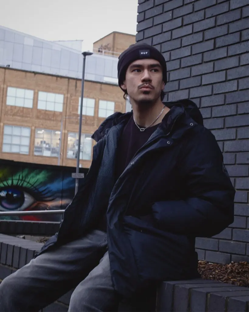 Ashley Hobday in black beanie and puffer jacket street portrait