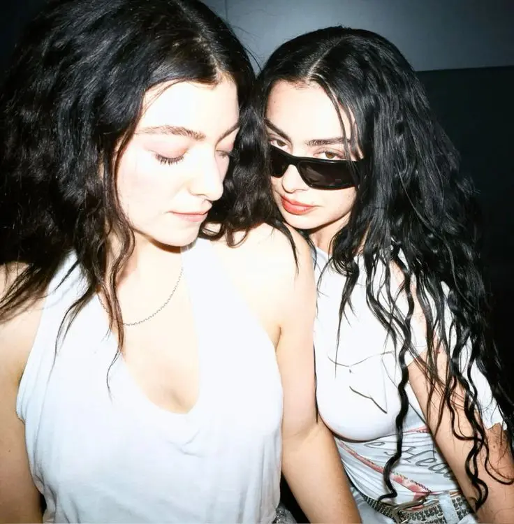 candid portrait of two female pop artists, backstage