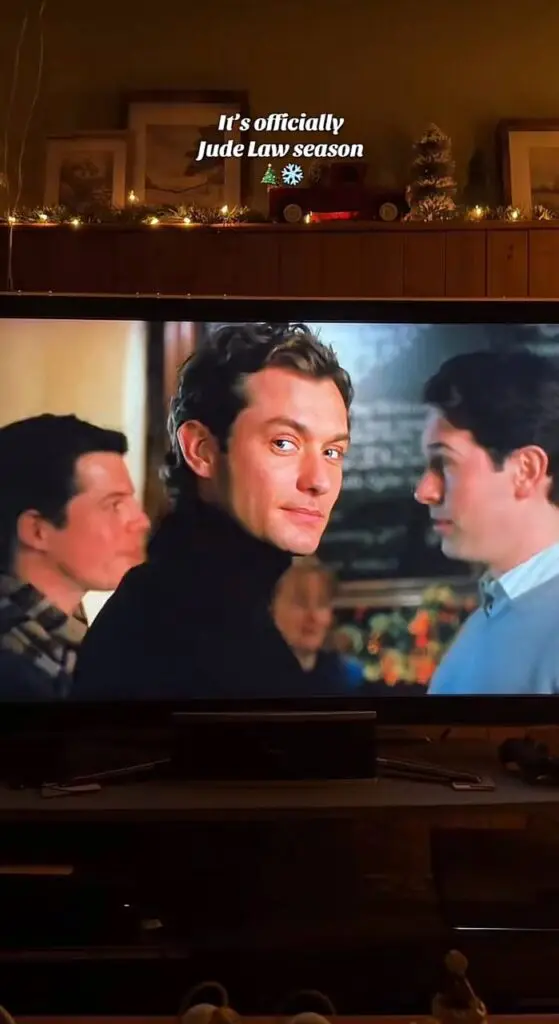 holiday movie night TV still with caption overlay