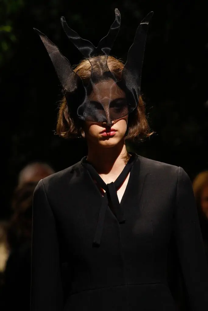 Dark surreal runway mask with sheer horned veil headpiece
