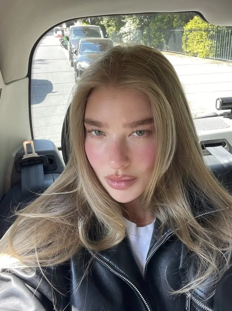 minimal makeup selfie with rosy cheeks and gloss