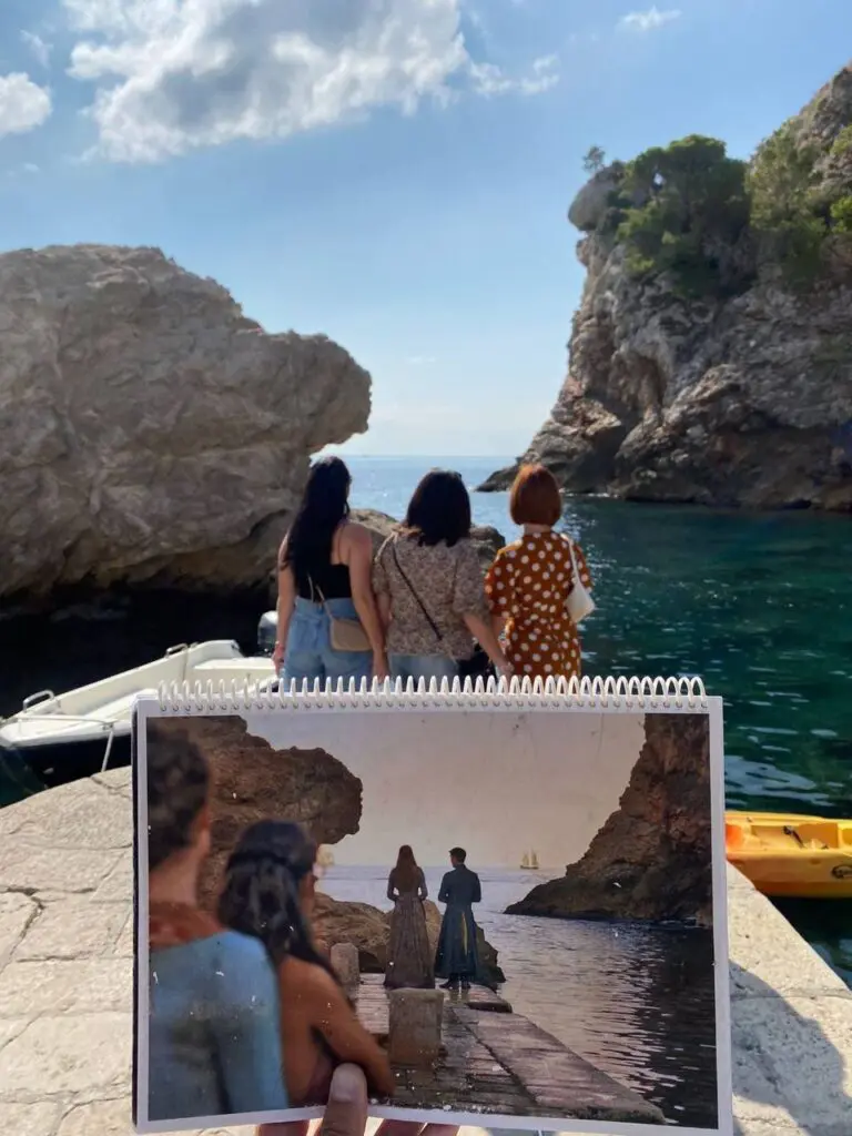 seaside set-jetting holding printed film still at rocky cove