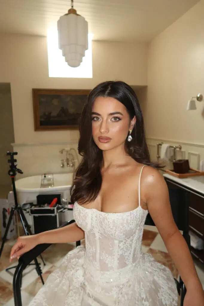 Behind the scenes bridal look in lace corset gown with pearl drop earrings